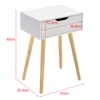 A white bedside table with wooden legs, shown with dimensions indicated by red lines and text. Náhled obrázku produktu