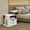 A bedside table with a laptop tray is placed next to a bed. Voir les images du produit