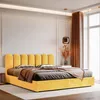 A bright yellow upholstered bed with a fluted headboard is shown in a bedroom with natural light coming from a large window. Anteprima dell’immagine prodotto