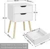 A bedside table with two drawers, shown with dimensions and a separate drawer to illustrate its size. Text provides weight capacities. Produktbild-Vorschau