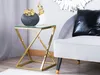 A modern side table with decorative vases next to a chair. Náhľad obrázku produktu