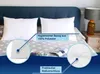 Two white pillows on a bed with a blue headboard and a star-patterned blanket. Produktbild-Vorschau