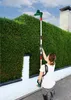 A person is using a telescopic hedge trimmer to trim a tall hedge. Produktbild-Vorschau