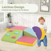 A child is playing with a colorful foam climbing set in a room. Produktbild-Vorschau