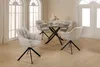 A dining room setting with a round table and four chairs. Produktbild-Vorschau