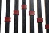 A close-up view of a bed frame's slatted base with adjustable plastic clips. Produktbild-Vorschau