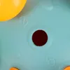 A close-up view of a blue toy with numbers and a hole in the center. Náhľad obrázku produktu