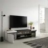 A modern living room setup featuring a TV stand with an electric fireplace, a large television, and decorative items. Produktbild-Vorschau