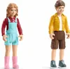 Two toy figures, a girl and a boy, standing against a white background. Anteprima dell’immagine prodotto