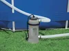 A pool heater connected to an above-ground pool, sitting on grass. Anteprima dell’immagine prodotto