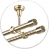 A close-up view of a double curtain rod with antique gold finish, mounted to the ceiling. Anteprima dell’immagine prodotto
