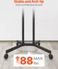 The base of a black rolling TV stand is shown on a light wood floor against a white wall. Produktbild-Vorschau