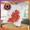 A bunch of cherry tomatoes vacuum-sealed in plastic, displayed on a wooden surface with a decorative award graphic in the background. Podgląd zdjęcia produktu