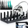 A product shot of a black lid holder and a smaller inset image of a similar product holding plates. Anteprima dell’immagine prodotto
