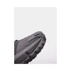 A close-up view of the heel and sole of a black sports shoe. Anteprima dell’immagine prodotto