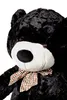 A close-up shot of a large black teddy bear with a checkered bow around its neck. Podgląd zdjęcia produktu