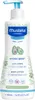 A bottle of Mustela Hydra Bébé Body Lotion with a pump dispenser, set against a white background with decorative green leaf motifs. Náhled obrázku produktu
