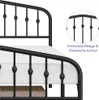 Close-up view of a black metal bed frame with a white mattress, showing decorative elements and a detail inset with text. Produktbild-Vorschau