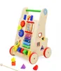 A wooden baby walker with various interactive toys and activities. Náhled obrázku produktu