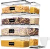 A stack of clear plastic food storage containers filled with various dry goods like cereal, pasta, and corn flakes. Each container has a black label with white text indicating its contents. Produktbild-Vorschau