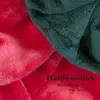 Close-up view of folded red and dark green plush fabric, with German text overlay. Anteprima dell’immagine prodotto