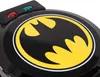 A close-up shot of a black waffle iron with the Batman logo. Produktbild-Vorschau