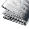 A folded silver picnic blanket. Produktbild-Vorschau