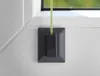 A close-up shot of a window blind accessory attached to a window frame. Produktbild-Vorschau