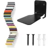 A collection of colorful books arranged in a curve, a black metal shelf bracket, and screws and wall plugs. Produktbild-Vorschau