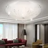 A modern living room with a red sofa, armchair, and floor lamp, featuring a decorative ceiling light. Anteprima dell’immagine prodotto