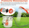 A portable shower pump in a bucket, with a shower head spraying water, set against a grassy background with trees. Náhled obrázku produktu