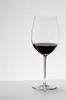 A glass of red wine on a white surface against a white background. Produktbild-Vorschau