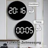 Two digital clocks are displayed on a wall, one showing '20:16' and labeled 'Countdown', the other showing '00:05' and labeled 'Timing'. Text at the bottom describes the timing/countdown function. Produktbild-Vorschau