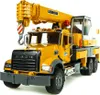 A yellow Bruder MACK Granite Liebherr crane truck is shown from a front-side angle against a white background. Náhľad obrázku produktu