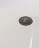A close-up view of a drain in a white bathtub. Náhled obrázku produktu