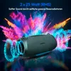 A dark gray Medion Bluetooth speaker is shown with colorful powder explosions behind it, suggesting powerful sound. Produktbild-Vorschau