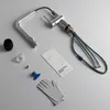 A kitchen faucet and its accessories laid out on a light gray surface. Produktbild-Vorschau