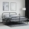 A bedroom scene with a black metal bed frame, bedding, and artwork on the wall. Podgląd zdjęcia produktu