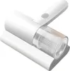 A white handheld vacuum cleaner with a clear dustbin is shown from a slightly elevated side angle, resting on a white surface. Náhľad obrázku produktu