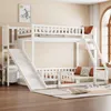 A white wooden bunk bed with a slide and ladder, set up in a room with wooden floors and a rug.