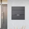 A modern mailbox mounted on a textured wall next to a doorway. Produktbild-Vorschau