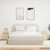 A bedroom scene with a bed, nightstands, and artwork. Náhľad obrázku produktu
