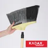 A hand holding a broom head, with the handle detached below. Podgląd zdjęcia produktu