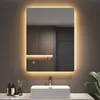 A bathroom vanity with a sink and a mirror with integrated LED lighting. Anteprima dell’immagine prodotto