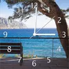 Wallario Design Wanduhr Einsame Bank am Meer - Spanien im Produktbild-Vorschau 1