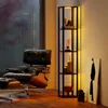 A cozy corner with a chair and a shelf with decorative items. Anteprima dell’immagine prodotto