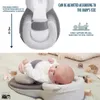 A baby lying on a soft mat with a baby support pillow. Produktbild-Vorschau