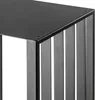 Close-up of a black metal firewood rack with vertical slats. Náhled obrázku produktu