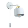 A white and gold adjustable wall lamp with a plug and switch, shown against a white background. Náhled obrázku produktu