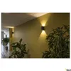A hallway with two wall lights illuminating the walls and plants. Produktbild-Vorschau